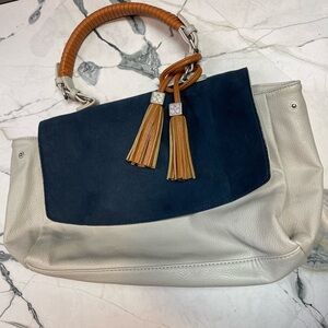 Vegan leather tasseled handbag with suede flap